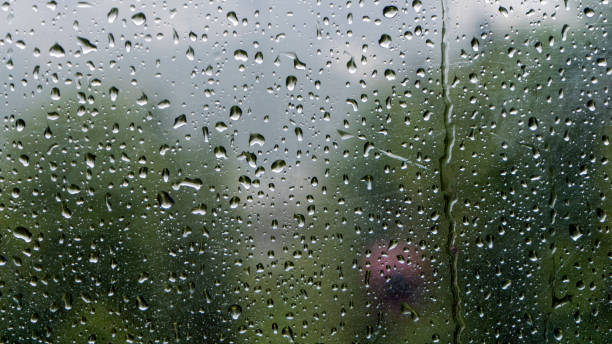 istock Raindrops on the window with blurred background of cable car in the rainy day. 1184653280