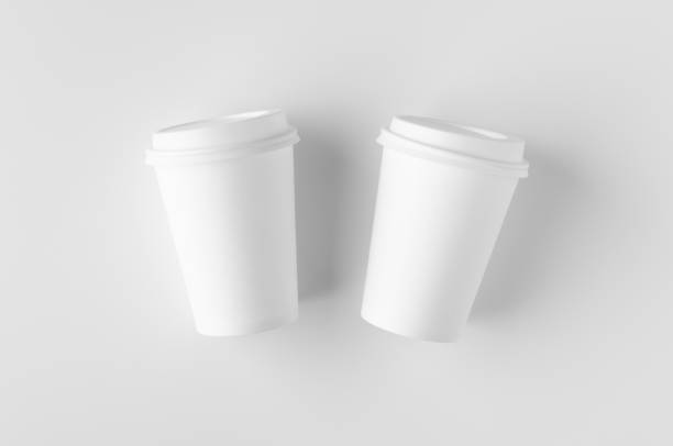 istock Top view of a 12 oz. white coffee paper cup mockup with lid. 1184653767