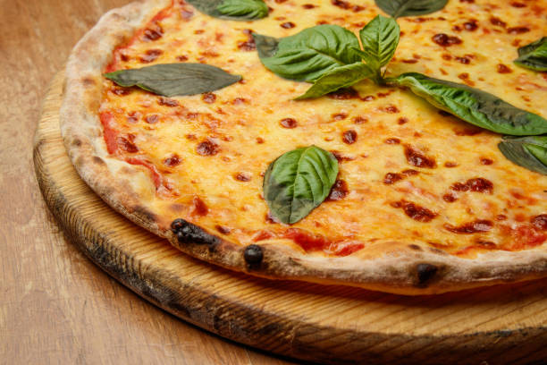 istock pizza with basil, Italian dish, pizzeria, presentation 1184653881