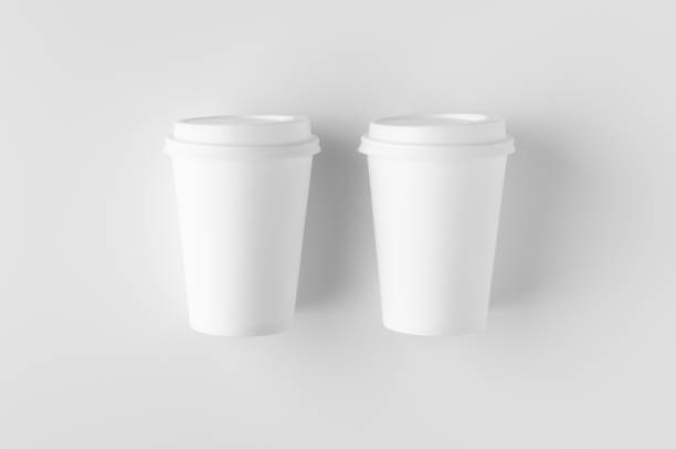istock Top view of a 12 oz. white coffee paper cup mockup with lid. 1184654706