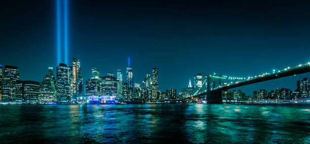 istock Manhattan skyline at night seen from Brooklyn. Tribute in Light 1184655217