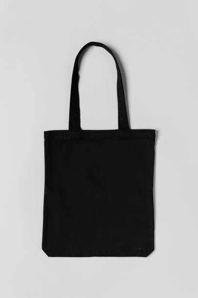 istock Black tote bag mockup on a grey background. 1184655922