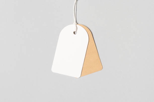 istock White and kraft clothing tag, gift tag mockup. 1184658842