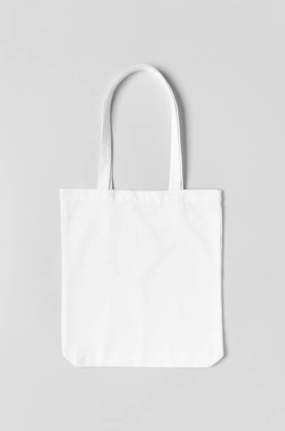 istock White tote bag mockup on a grey background. 1184659271