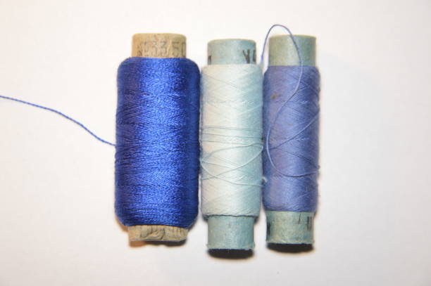 istock Spools of thread for sewing clothes close-up 1184659528