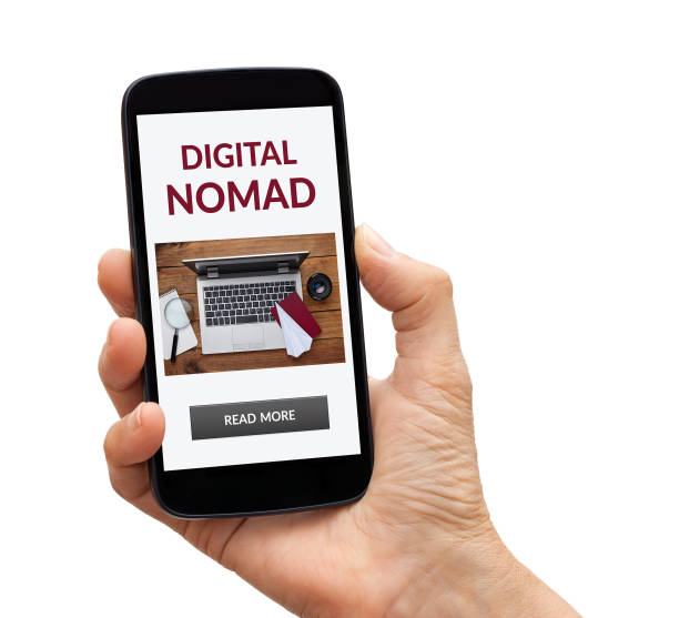 istock Hand holding smart phone with digital nomad concept on screen 1184663119