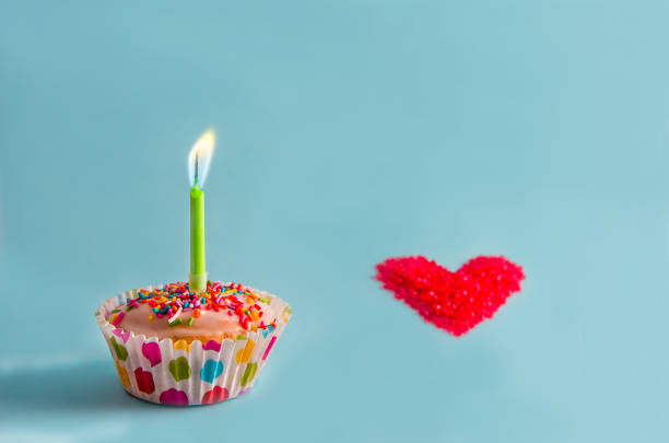 istock Congratulations. muffin, cupcake with a candle. birthday 1184663609