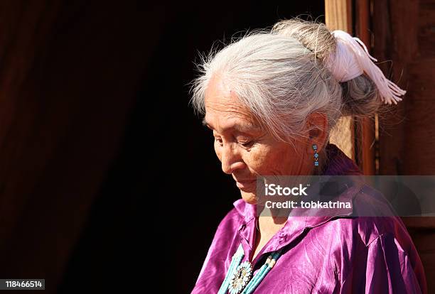 Navajo Woman Looking Down Outdoors In Bright Sun Stock Photo - Download Image Now - Senior Adult, Indigenous North American Culture, Women
