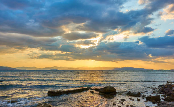 istock Sunset with colorful clouds over the sea 1184666462