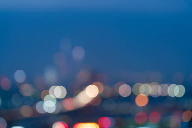 istock Blurred abstract grey glass blurred blue lights background 1184669156