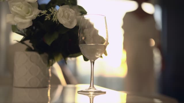 Stylish woman with glass of water