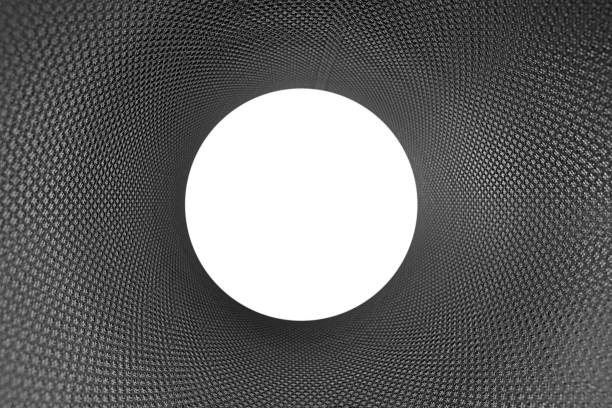 Inside view of carbon black textured tube with white center and copy space inside. Abstract texture and background