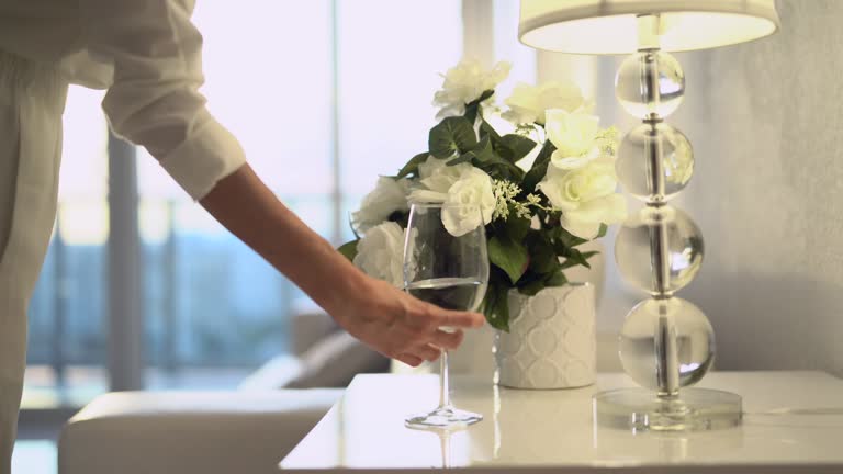 Stylish woman with glass of water