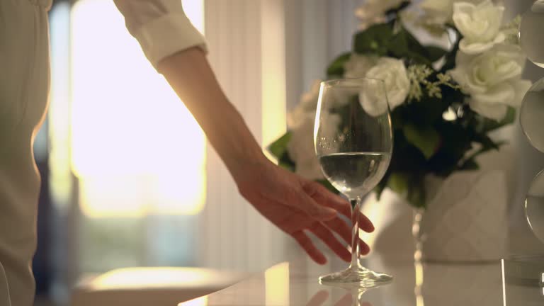 Stylish woman with glass of water