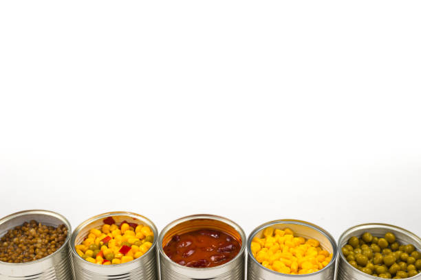 istock Canned food on white background. Green pea, beans, corn, lentils. 1184675680