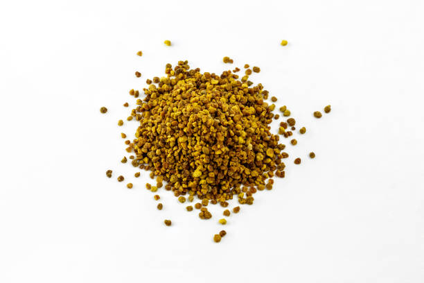 istock group of bee pollen on white background 1184676241