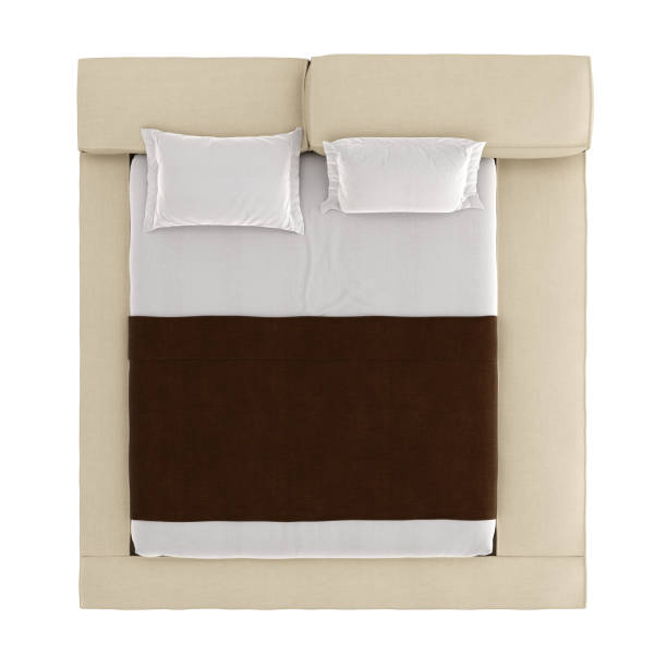 istock Bed with a blanket and pillows on an isolated background. 3d rendering 1184677196