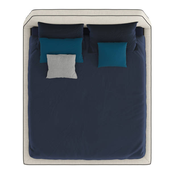istock Bed with a blue blanket and pillows on an isolated background. 3d rendering 1184677223