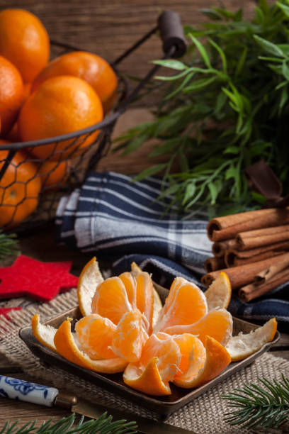 istock Peeled tangerine on the wooden table. 1184681788