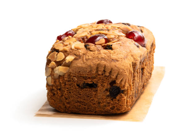 Mixed  fruit loaf cake with almond flakes isolated on white