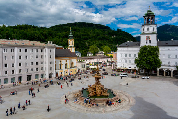 Famous place The Residenzplatz square with Residenz fountain in the Old Town of Salzburg, Austria, View from above. salzburg stock pictures, royalty-free photos & images