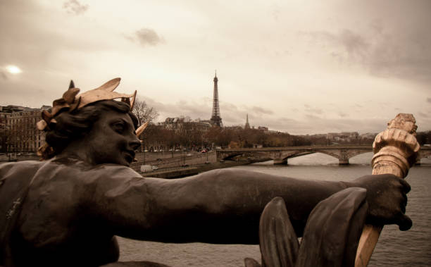 istock Bronze sculpture on a bridge and Eiffel Tower in Paris 1184689413