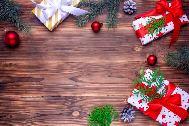 istock Christmas gifts on wooden table. Top view. Flat lay. Copy space. 1184691495