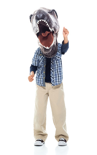 Full length of boys standing wearing mask - disguise / costume who is humor / wearing dinosaur mask