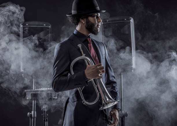 istock Black Man playing jazz trumpet 1184696382