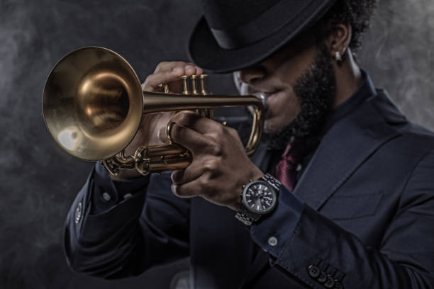 istock Black Man playing jazz trumpet 1184696695