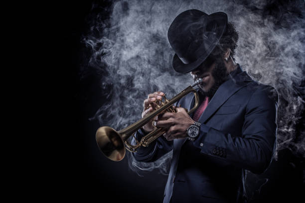 istock Black Man playing jazz trumpet 1184696700