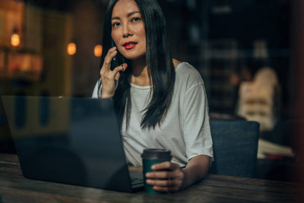 istock Pretty woman talking on phone 1184696825
