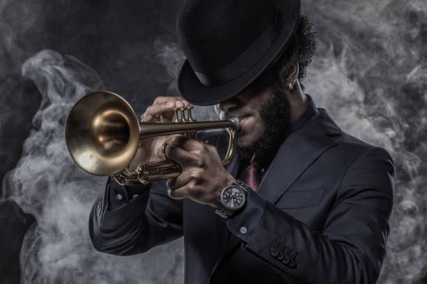 istock Black Man playing jazz trumpet 1184697016