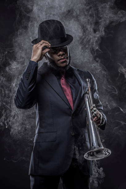 istock Black Man playing jazz trumpet 1184697771