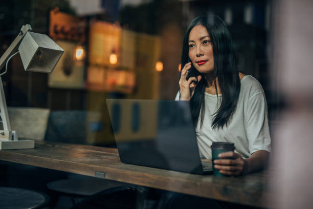 istock Busy woman talking on phone 1184697947