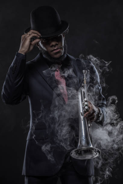 istock Black Man playing jazz trumpet 1184698192