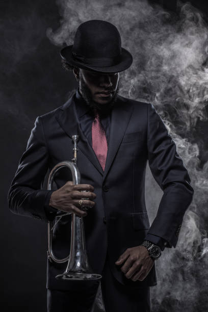 istock Black Man playing jazz trumpet 1184698380