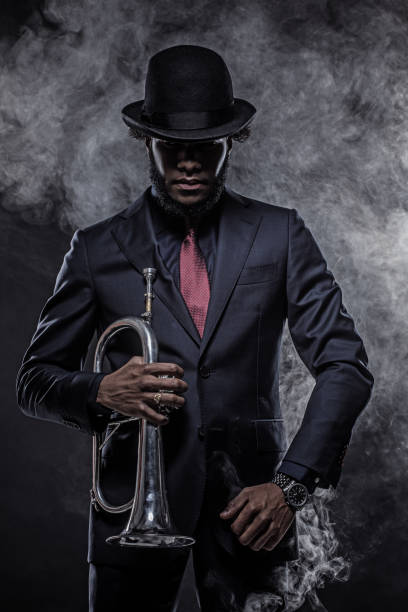 istock Black Man playing jazz trumpet 1184698386