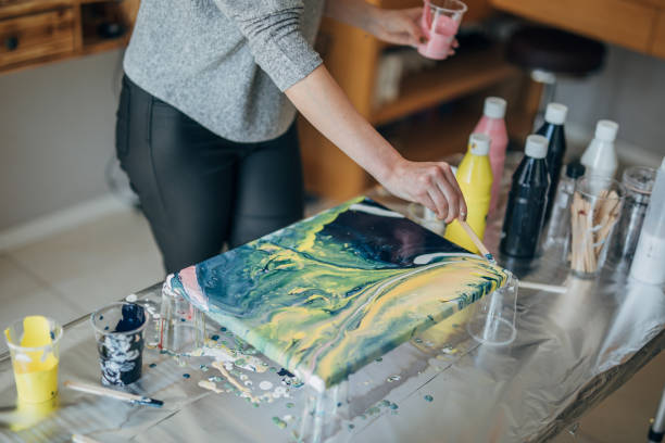 istock Woman painting in art studio 1184698445