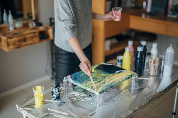 istock Woman painting 1184698476