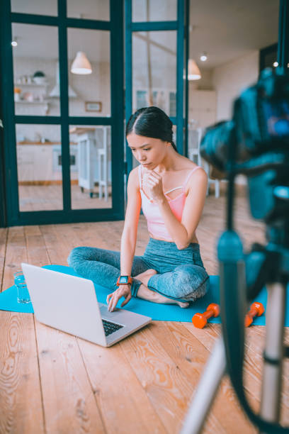 Fitness blogger feeling overloaded with too much job Blogger feeling overloaded. Dark-haired fitness blogger feeling overloaded with too much job too thin stock pictures, royalty-free photos & images
