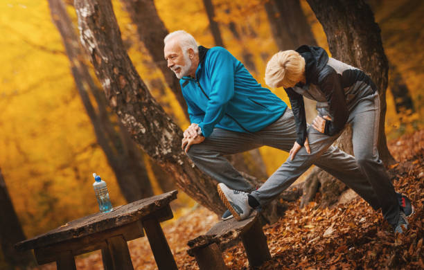 istock Senior couple exercising in a park. 1184703044