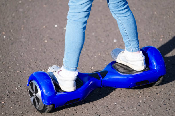 istock Young girl practising balance activity on hoverboard 1184703128