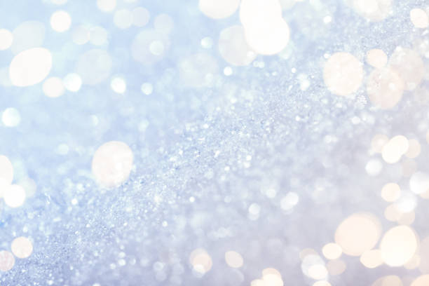 istock Chritmas light background with snow and gold lights 1184703132