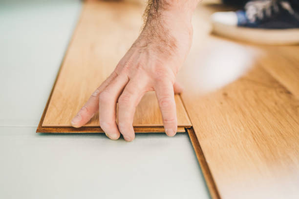 istock Wood floor imitation - simplicity of laminate installation 1184704073