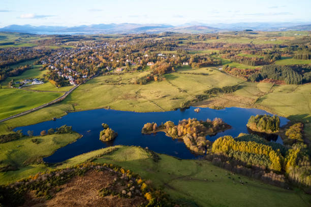 istock Aerial view over Knapps Loch in Kilmacolm during sunset 1184704102