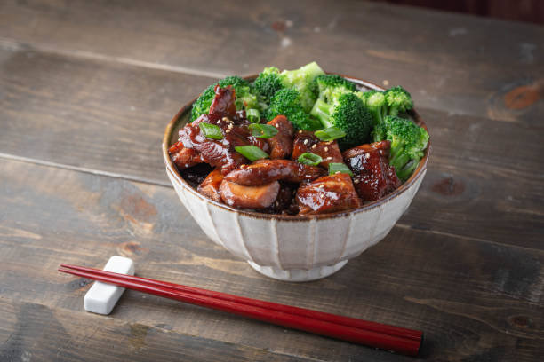 istock teriyaki chicken rice bowl with broccoli 1184706248