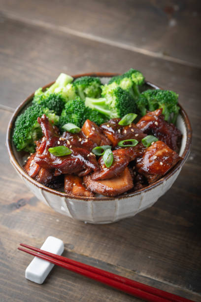 istock teriyaki chicken rice bowl with broccoli 1184706254