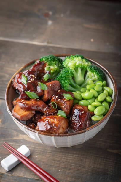 istock teriyaki chicken rice bowl with broccoli and edamame 1184706332