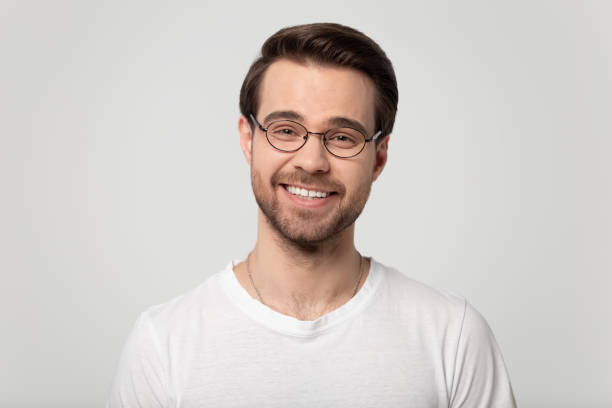 istock Young happy guy wearing glasses looking at camera portrait. 1184709924